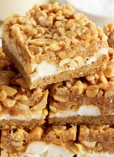 Close up front view of Salted Nut Roll Bars stacked on each other.
