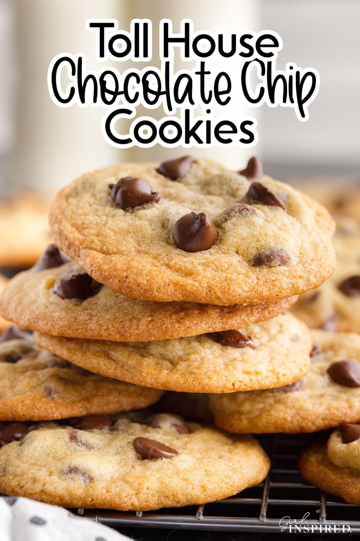 Stack of Toll House chocolate chip cookies on a cooling rack with text title.