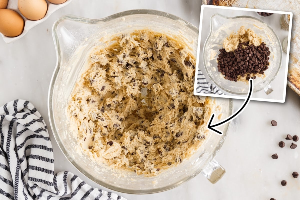 Before and after adding chocolate chips, cookie dough mixed together in a mixing bowl next to eggs and baking sheet.