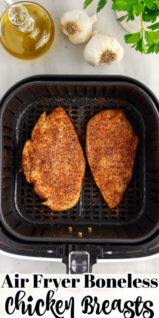 Air Fryer Boneless Chicken Breasts in an air fryer basket after being cooked.