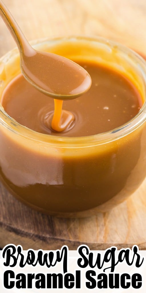 Close up of brown sugar caramel sauce in a glass jar with a metal spoon dripping with caramel sauce.