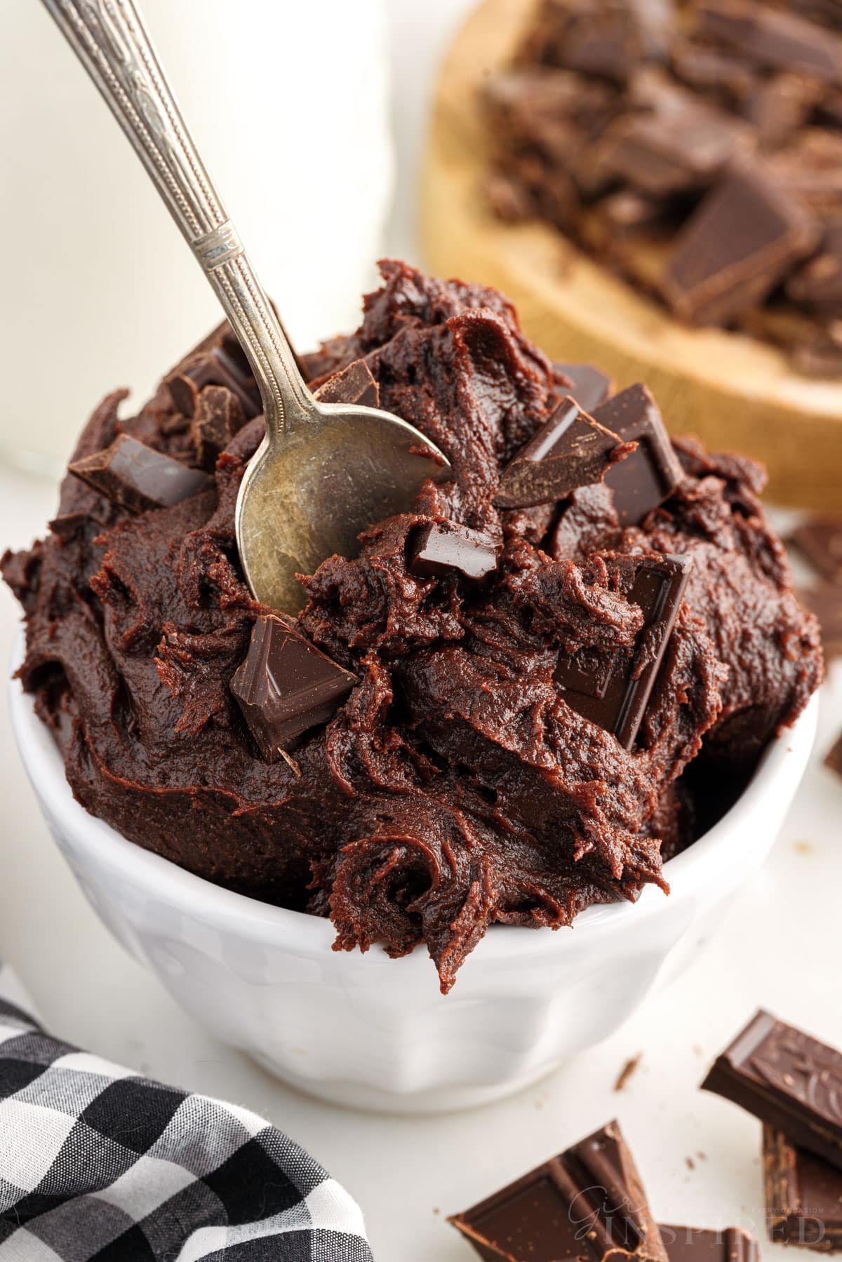 A serving bowl with Edible Brownie Batter a spoon inserted.