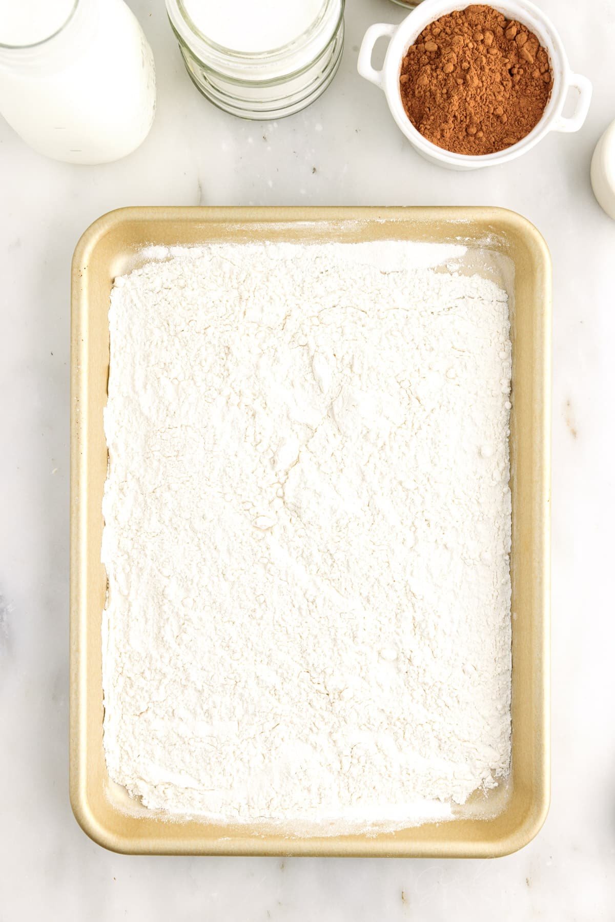 Flour on a cookie sheet.