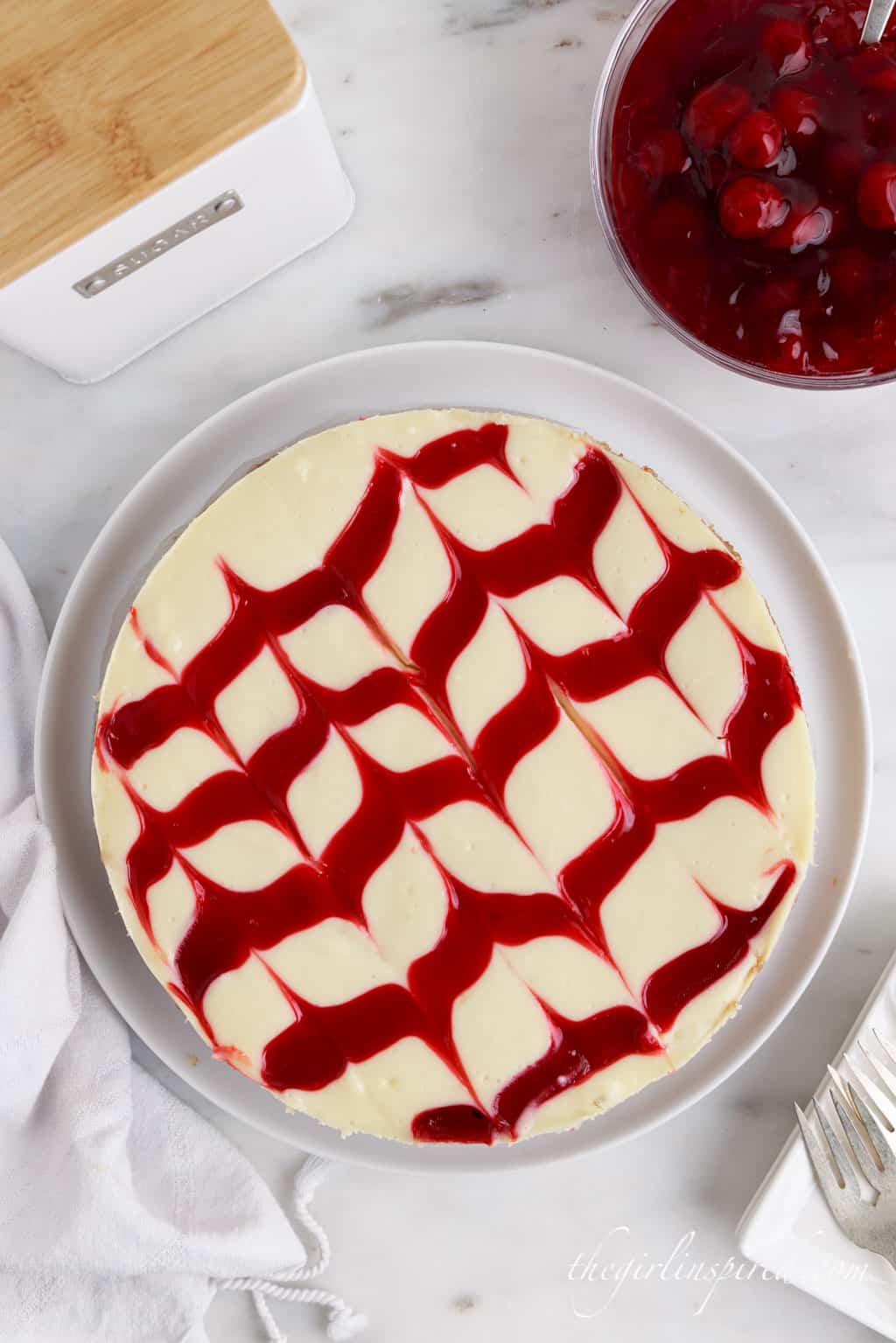 Cherry Cheesecake on a plate.