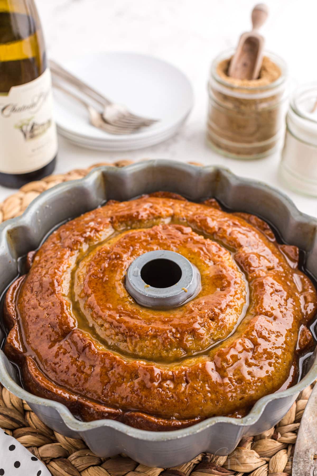 Freshly baked and glazed crack cake in a bundt pan.