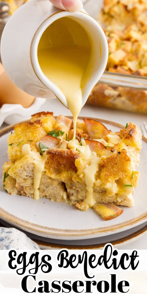 Hollandaise sauce poured over a slice of Eggs Benedict Casserole with the casserole in the background.