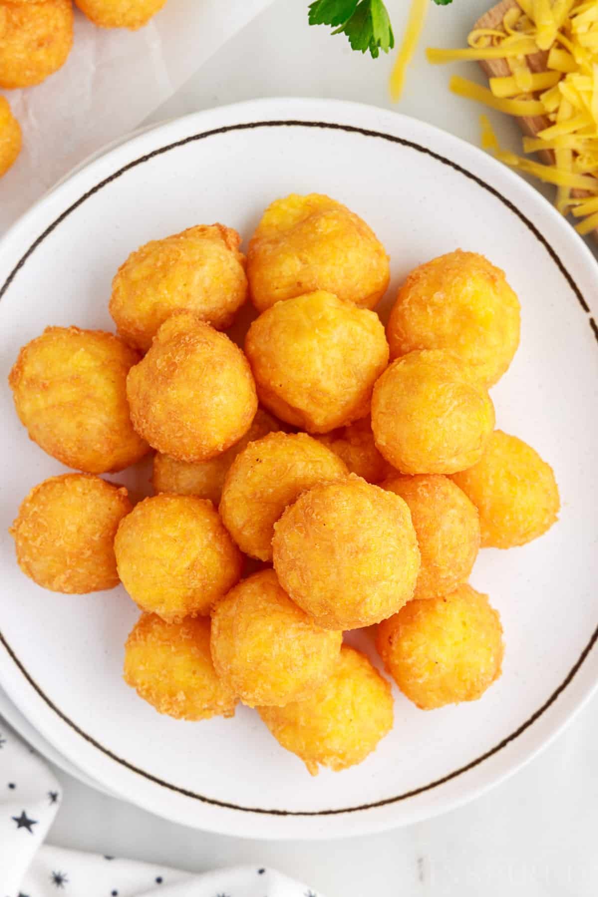Overhead view of a plate of Fried Cheese Balls.