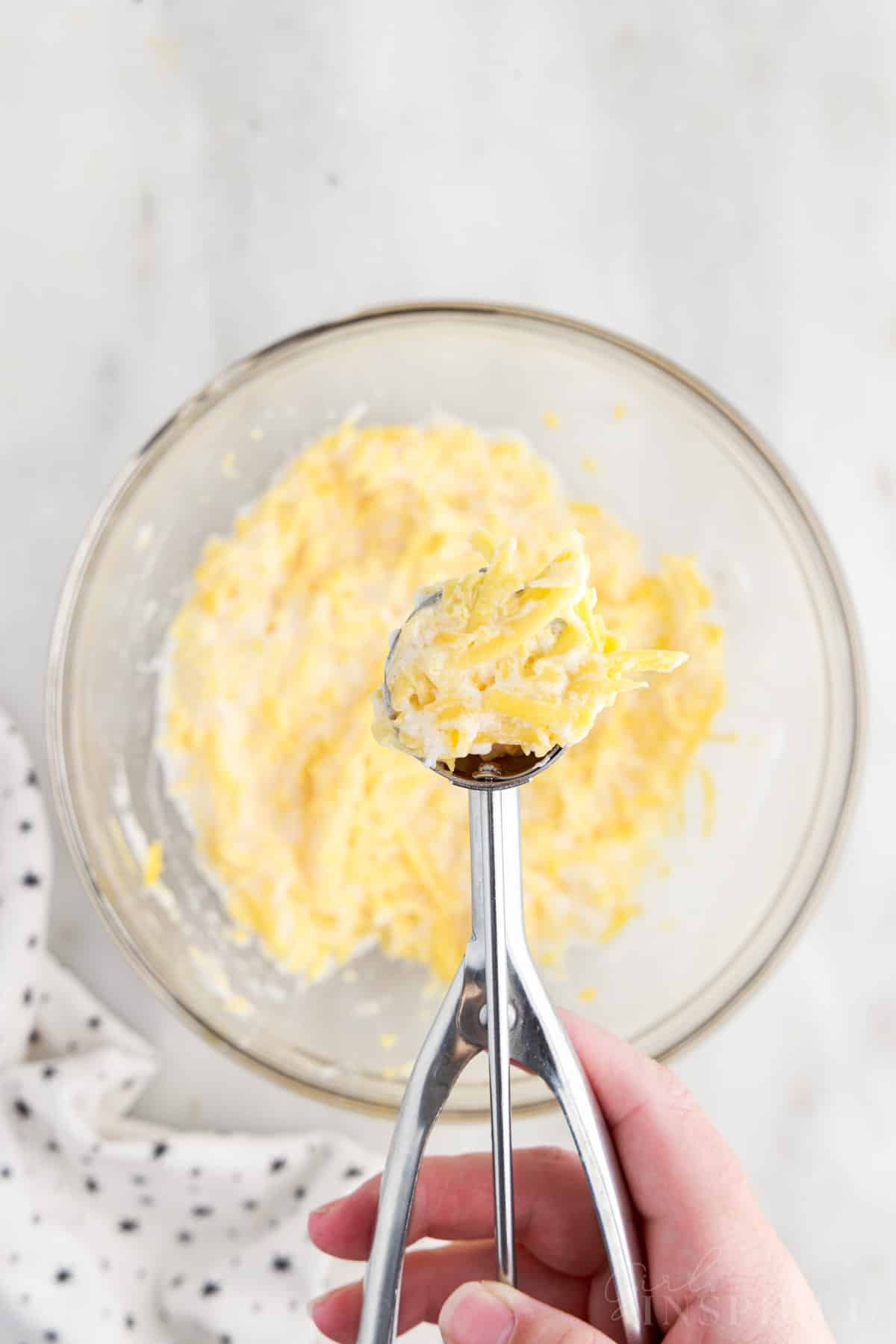 Cookie scoop full of Fried Cheese Ball "dough."