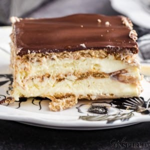 Single slice of no bake eclair cake on a serving plate.