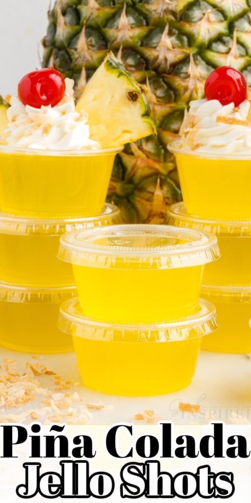 Piña Colada Jello Shots stacked on each other with a pineapple in the background.