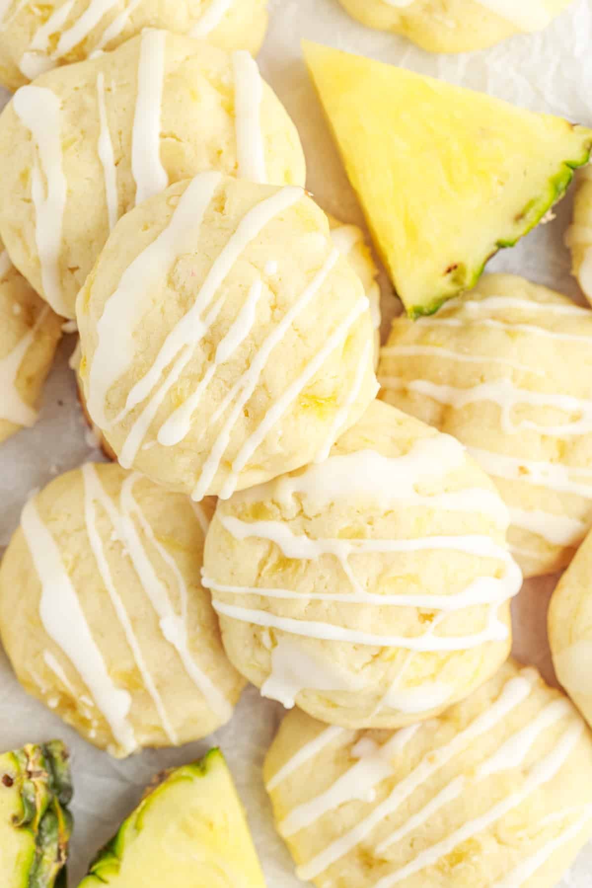 Overhead view of Pineapple Cookies next to slices of pineapple wedges.