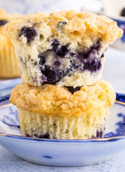 Close up of two Sourdough Blueberry Muffins stacked on each other.
