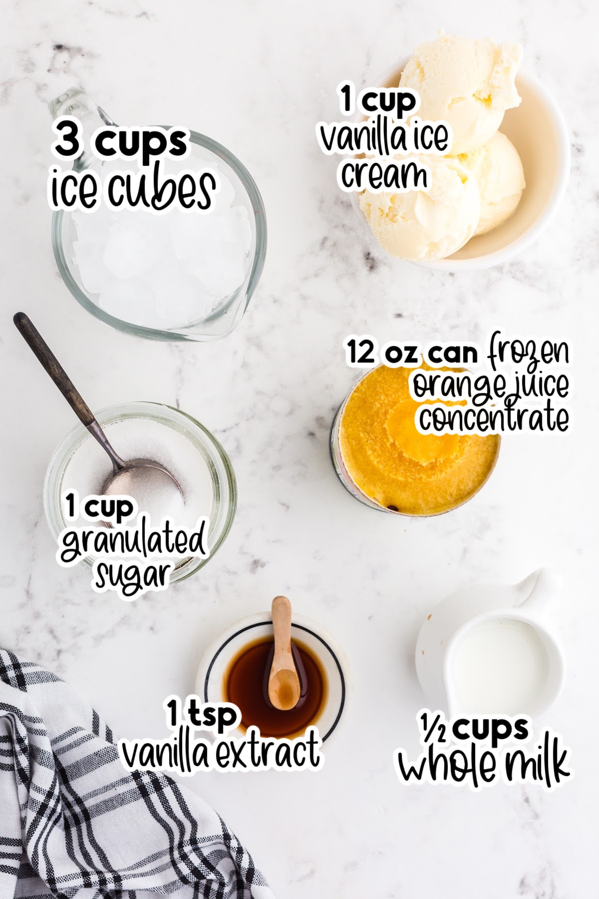 Orange Julius recipe ingredients on a marble countertop, with text and ingredient labels.