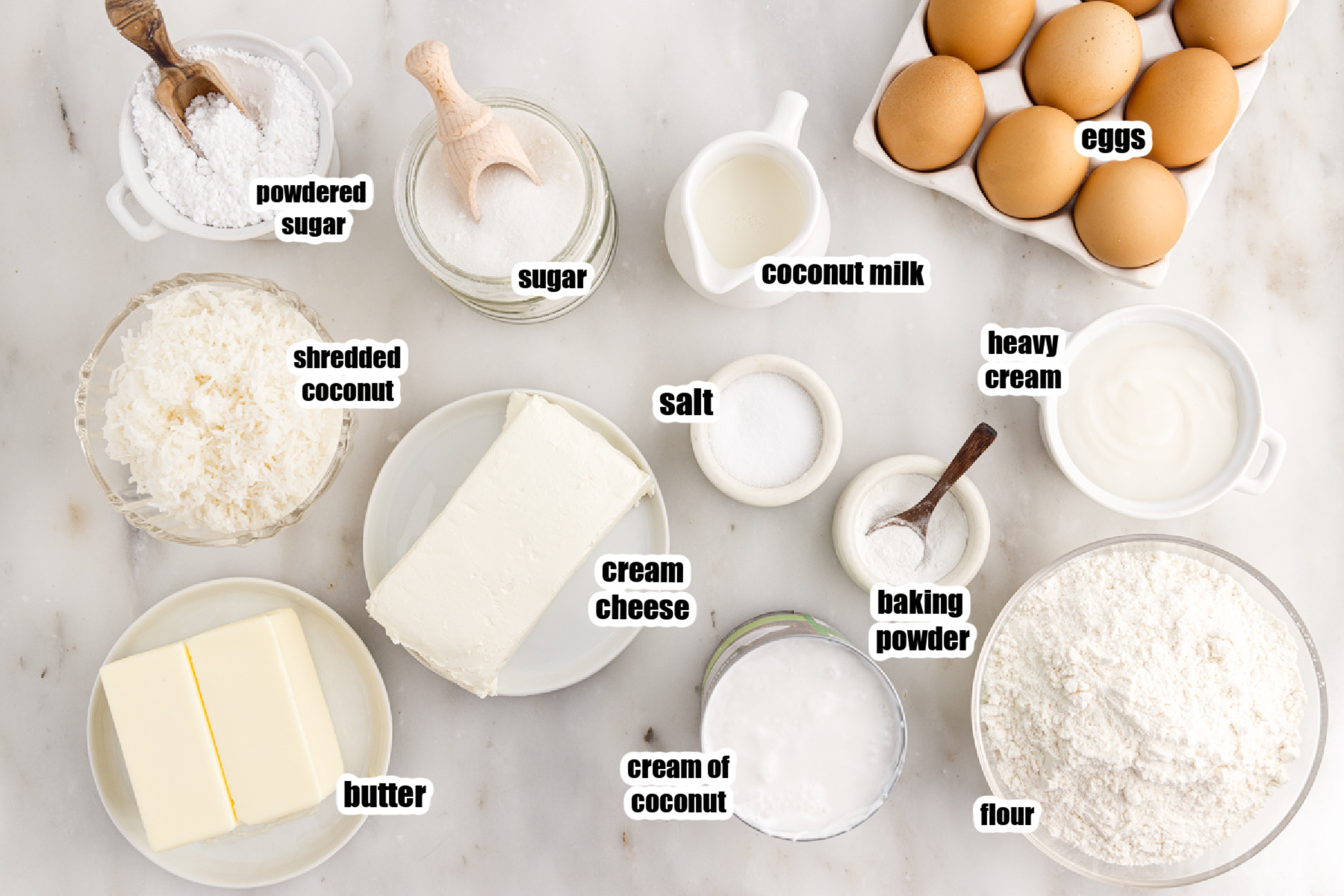 Individual ingredients needed for the coconut cream cake and coconut cream cheese frosting.