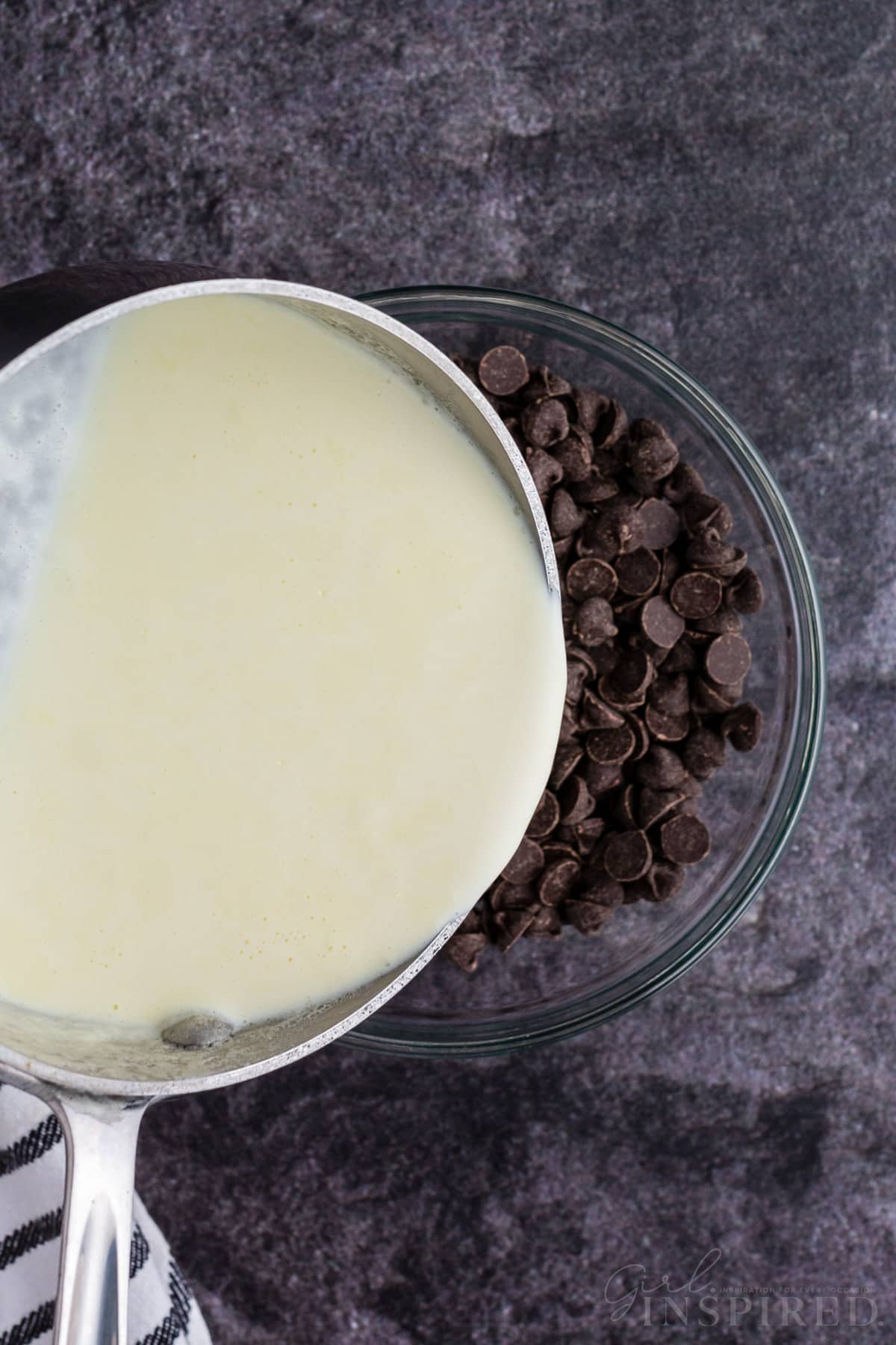 Heavy whipping cream poured over dark chocolate chips.