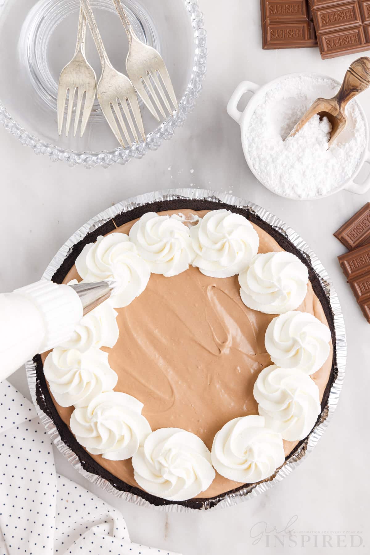 Cool whip piped around edges of pie.