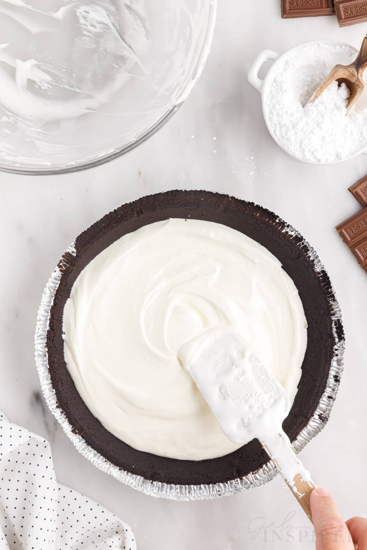 Cream cheese mixture spread on the bottom of the chocolate pie crust.