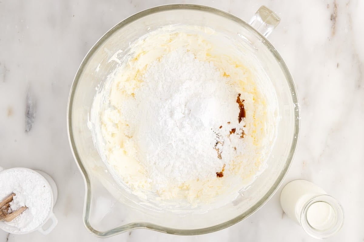 Dry cake ingredients in a glass mixing bowl.