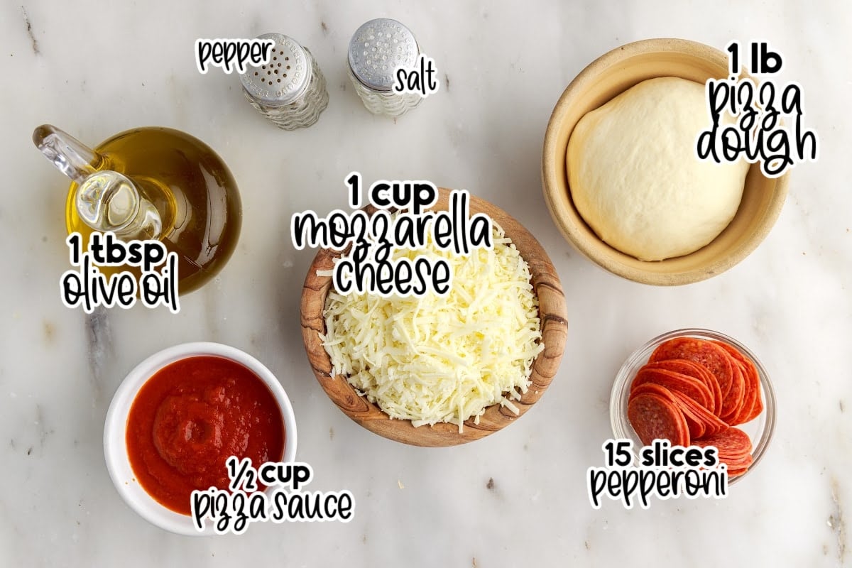 Individual ingredients for cast iron pizza with text labels.