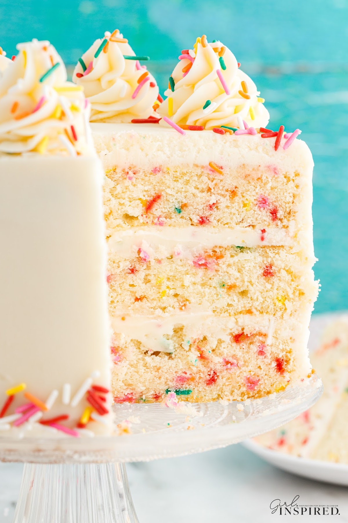 Slices missing from a Funfetti Cake.