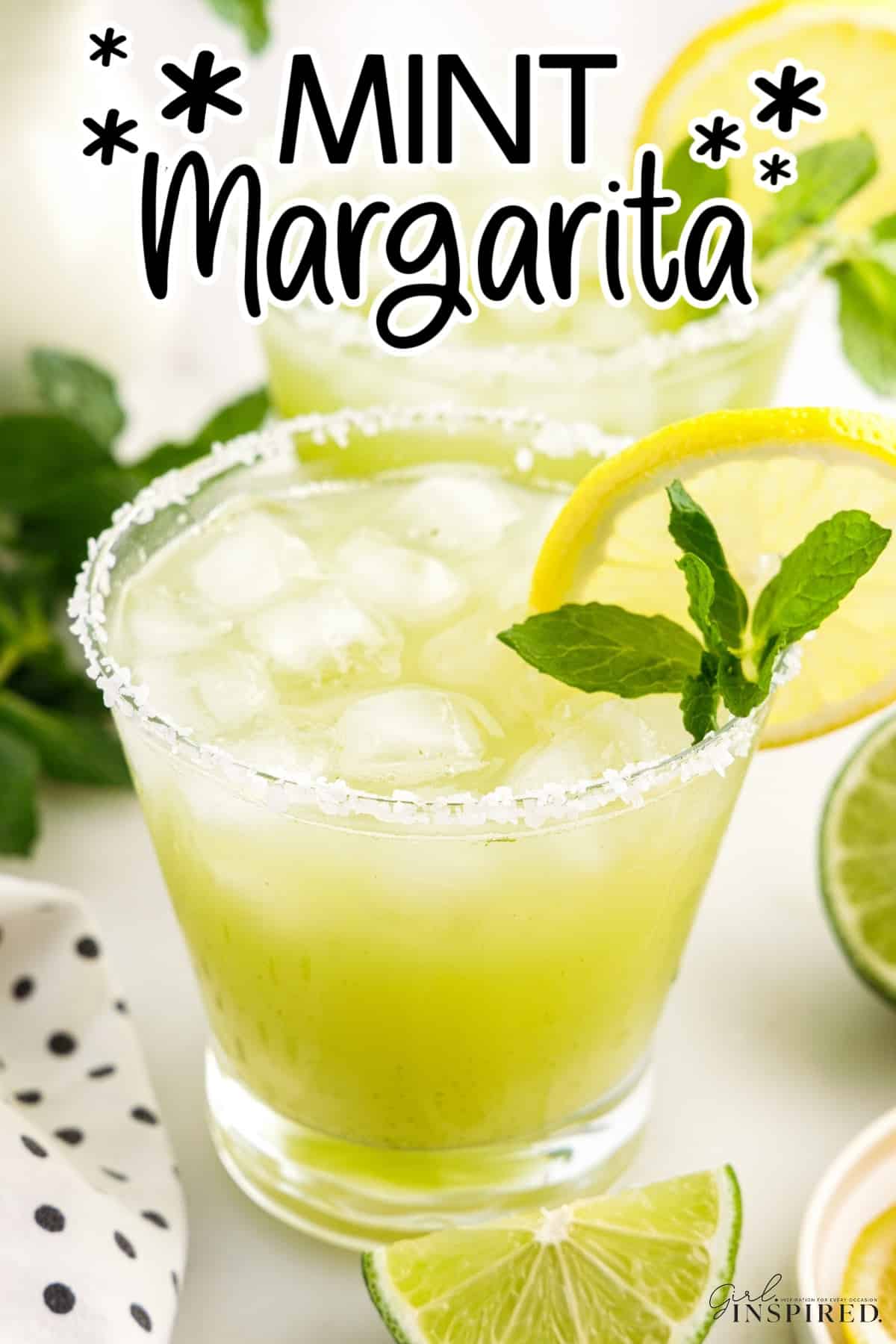 Mint Margarita garnished with salt, mint and lemons with text overlay.