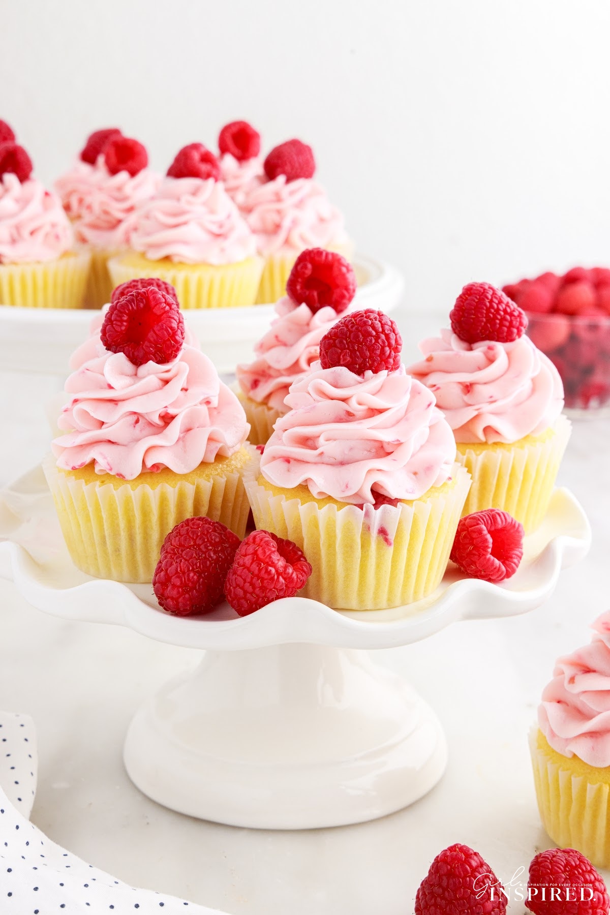 Raspberry Cupcakes on a tiered tray.