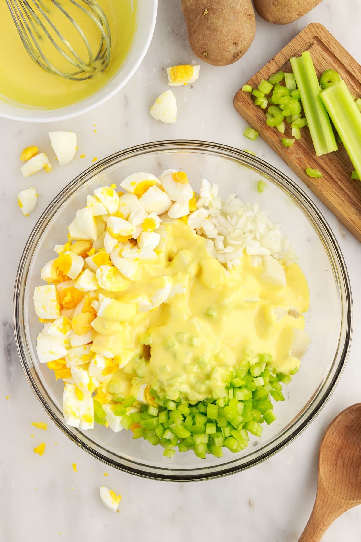 Amish Potato Salad dressing on top of Amish Potato Salad.