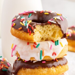 Close up of a stack of Cake Mix Donuts a bite taken from the top one.