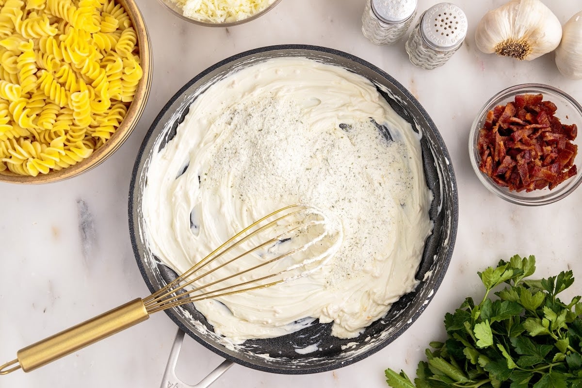 Cream cheese whisked in skillet.