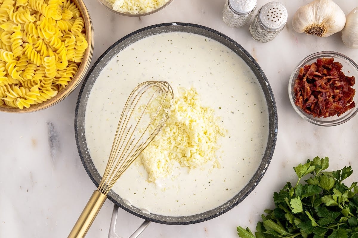 Grated cheese added to the cream cheese milk mixture.