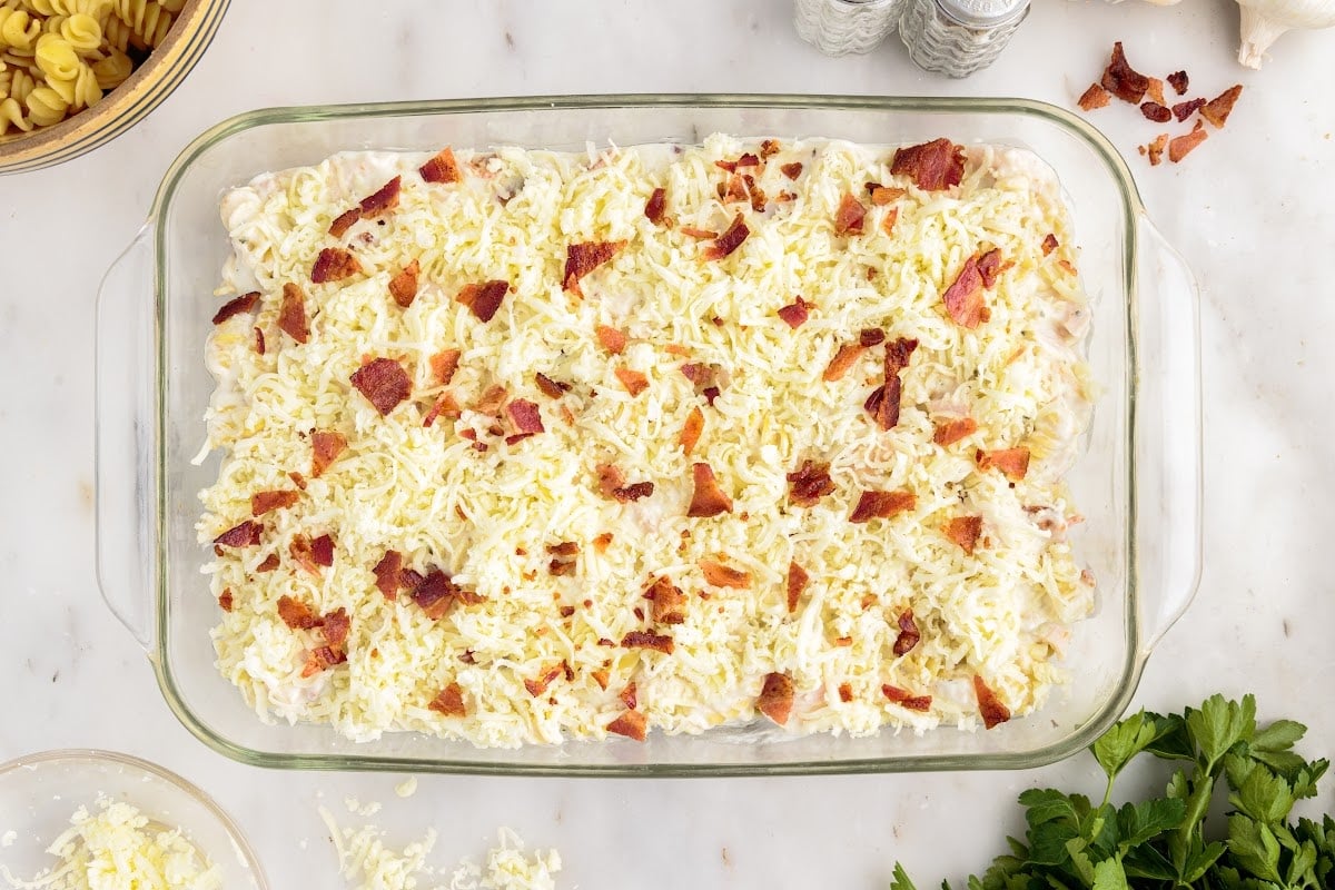 Bacon pieces added to the top of the casserole.