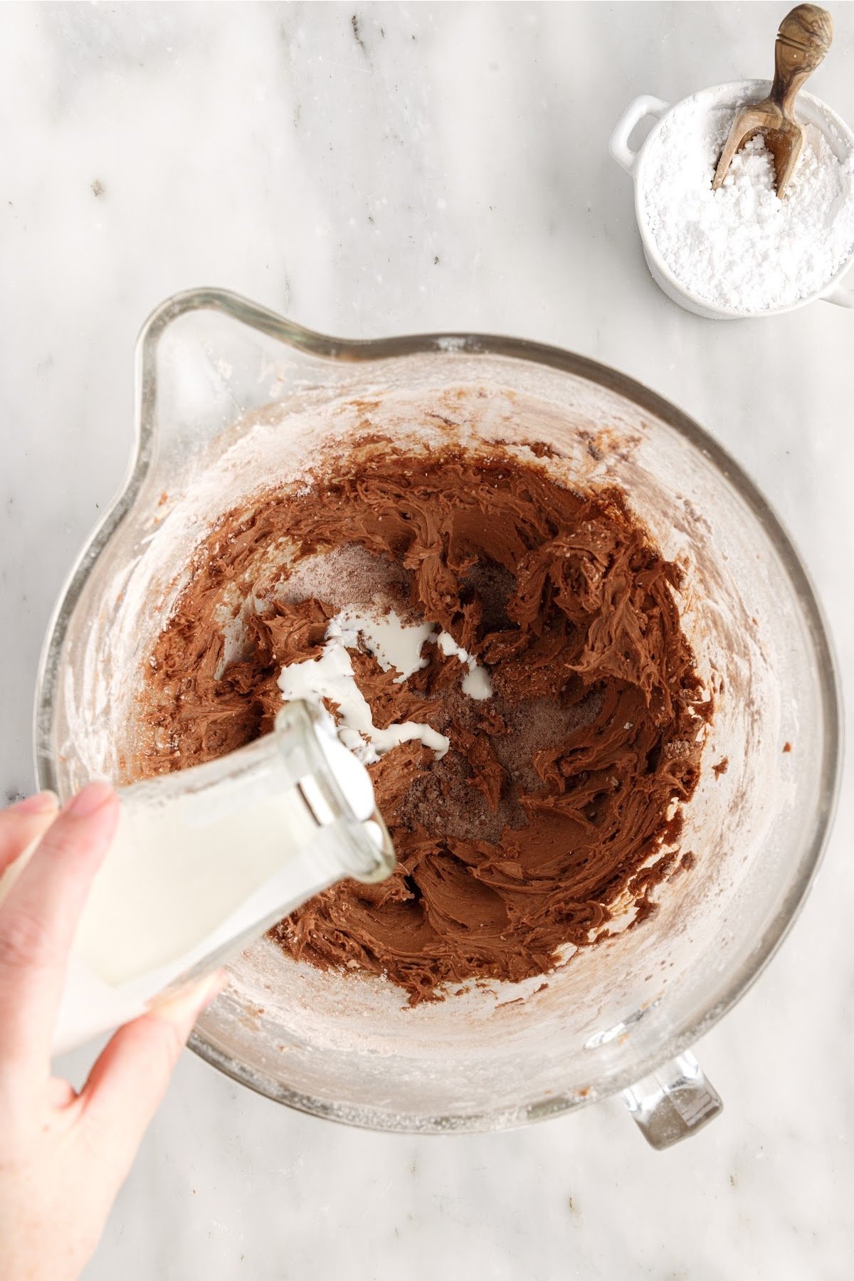 Heavy whipping cream added to cocoa powder mixture.