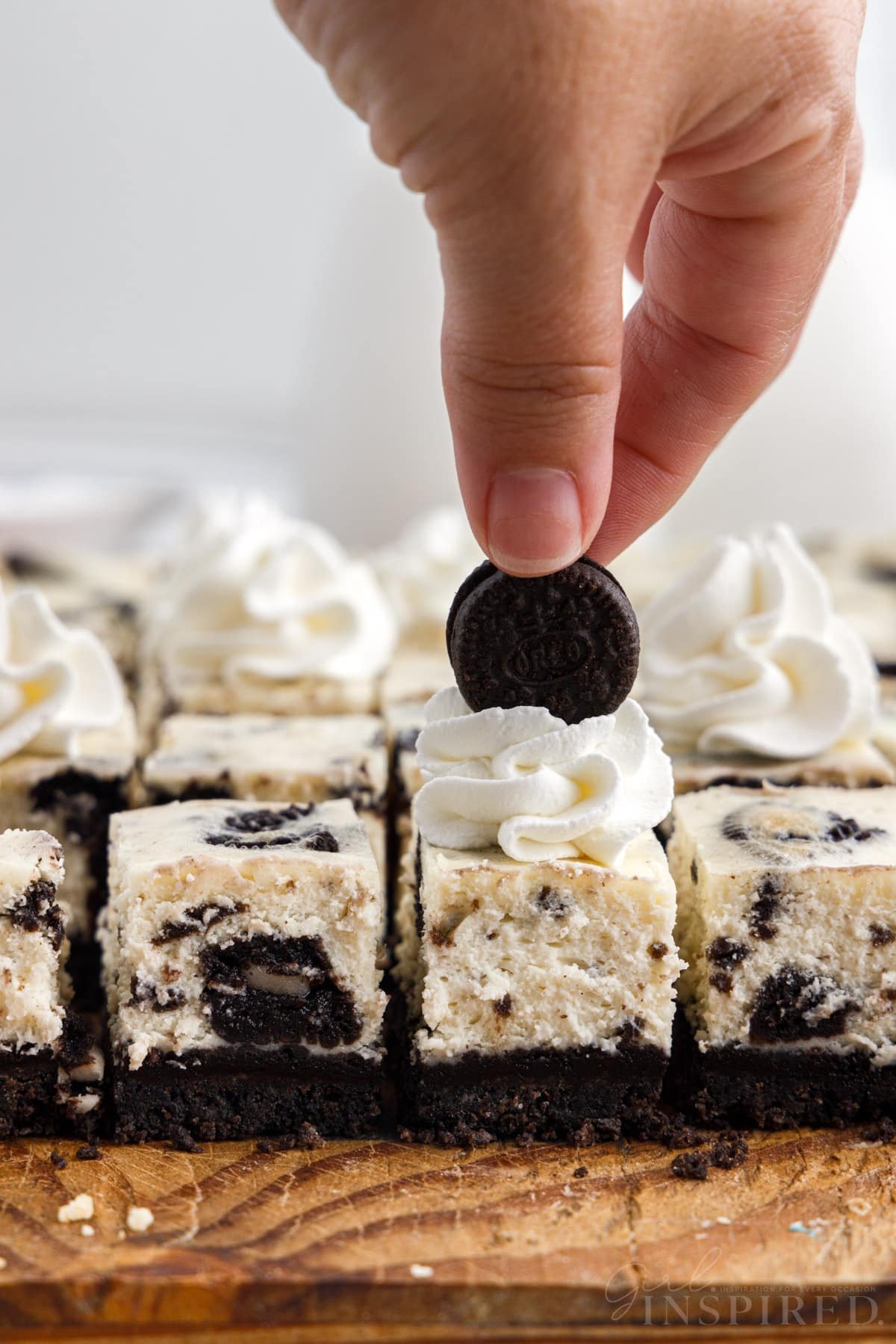 A mini oreo placed on top of the Oreo Cheesecake Bites.