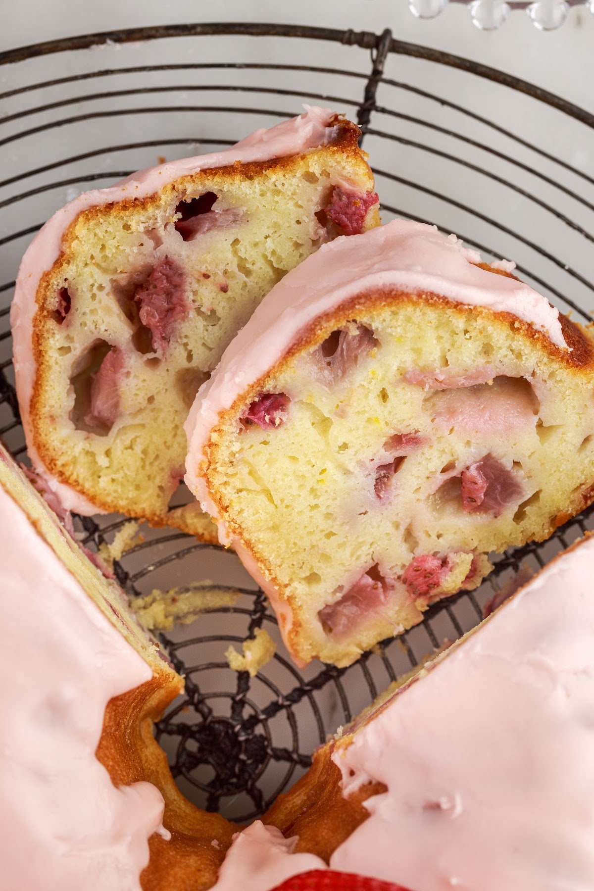 Close up overhead of two slices of Strawberry Bundt Cake.