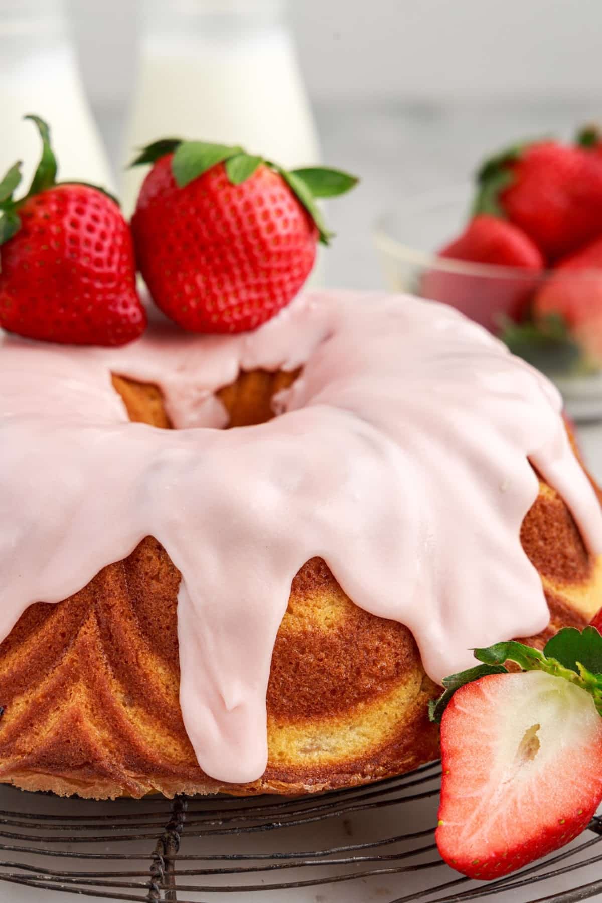 Front view of Strawberry Bundt Cake topped with strawberries.