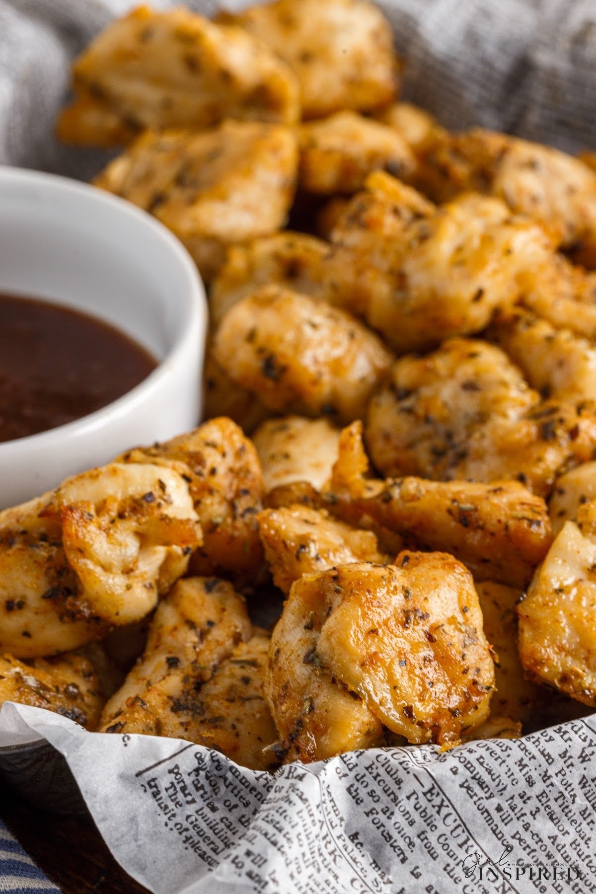 Front close up of Air Fryer Chicken Bites in a basket.