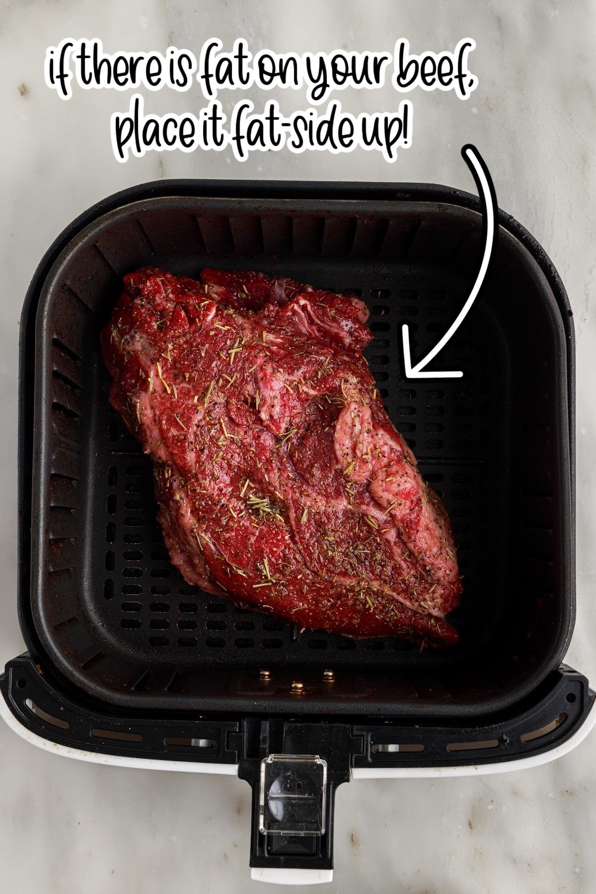 Air Fryer Roast Beef in an air fryer with text overlay.
