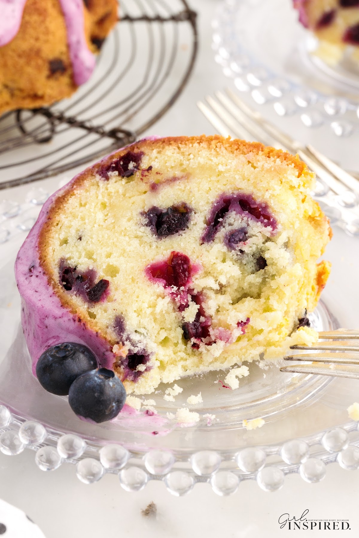 A slice of Blueberry Pound Cake on a small dish.