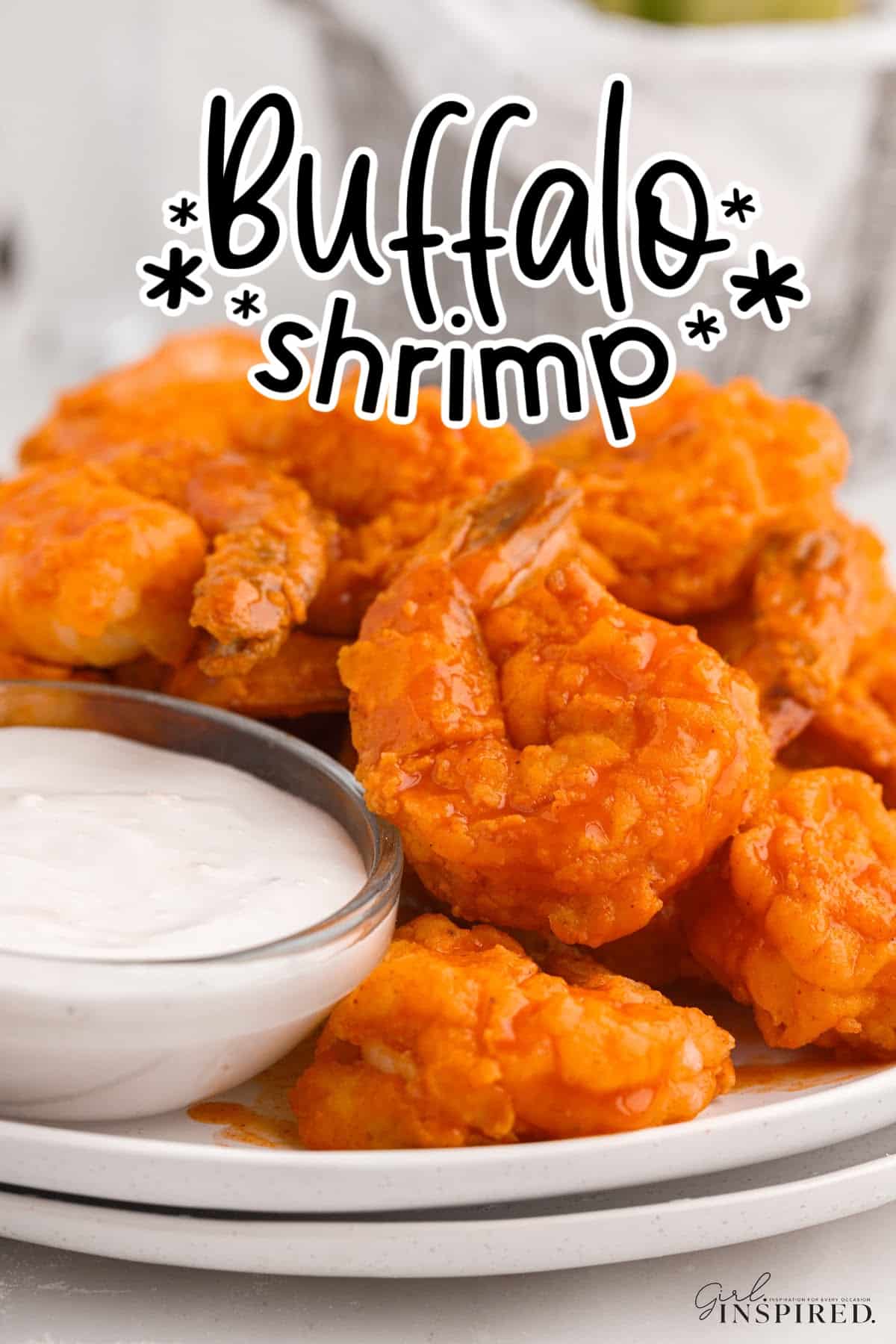 Buffalo Shrimp on a plate next to dipping sauce with text overlay.