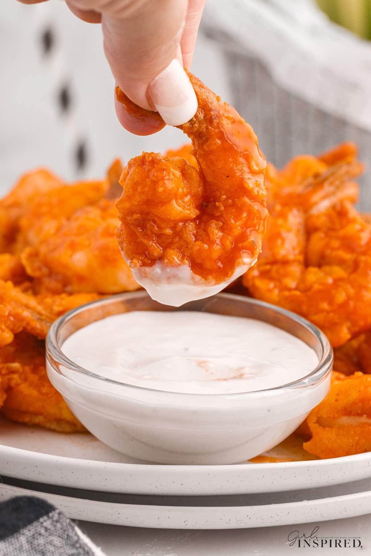 A Buffalo Shrimp after dipped into sauce.