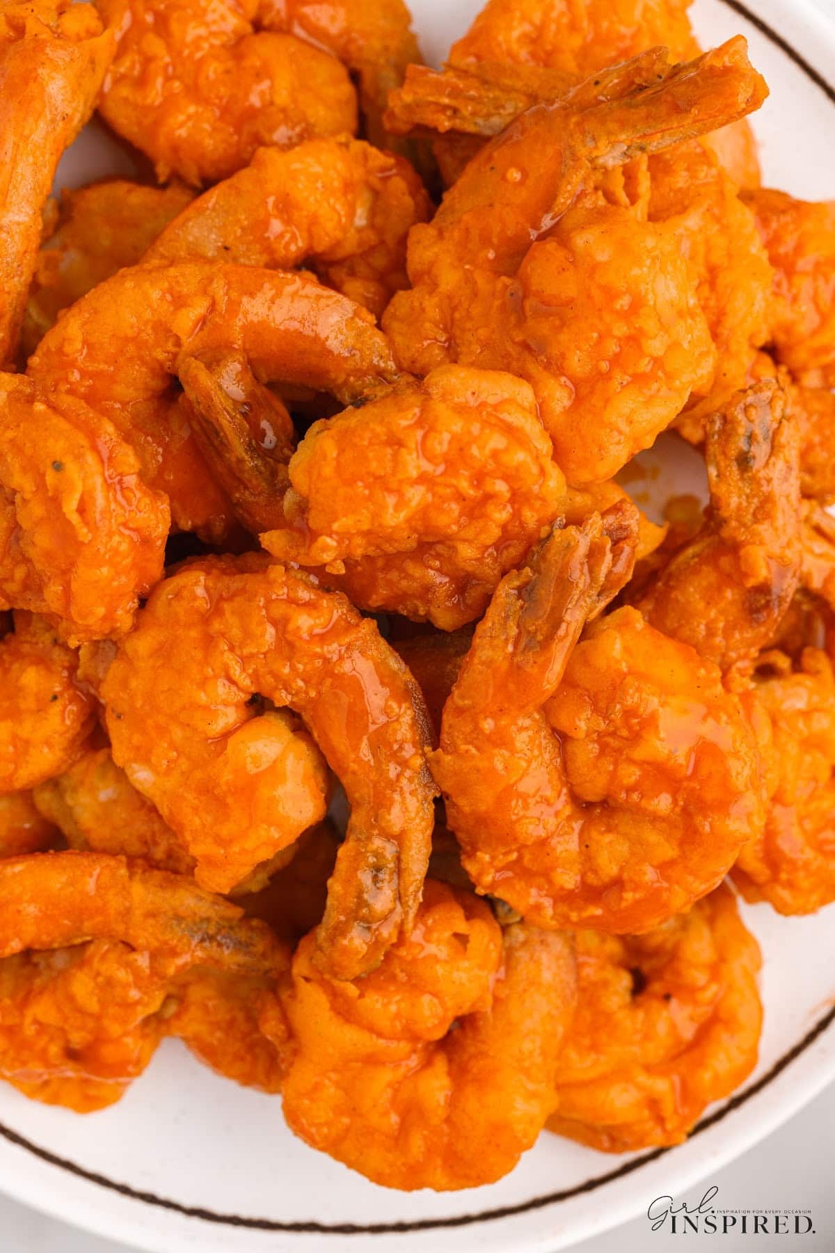 Overhead view of Buffalo Shrimp on a plate.