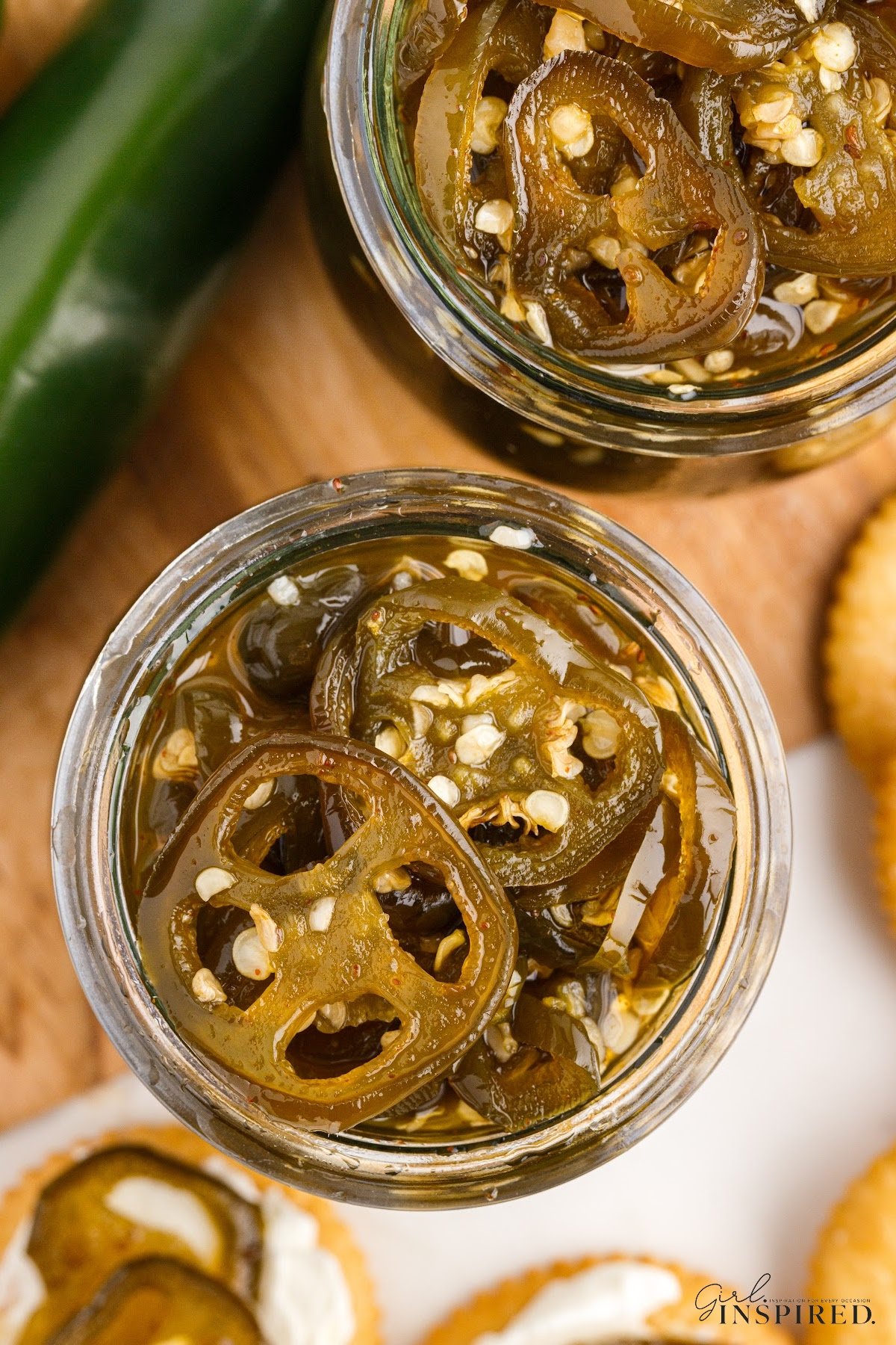 Overhead view of canning jar of Candied Jalapeños.