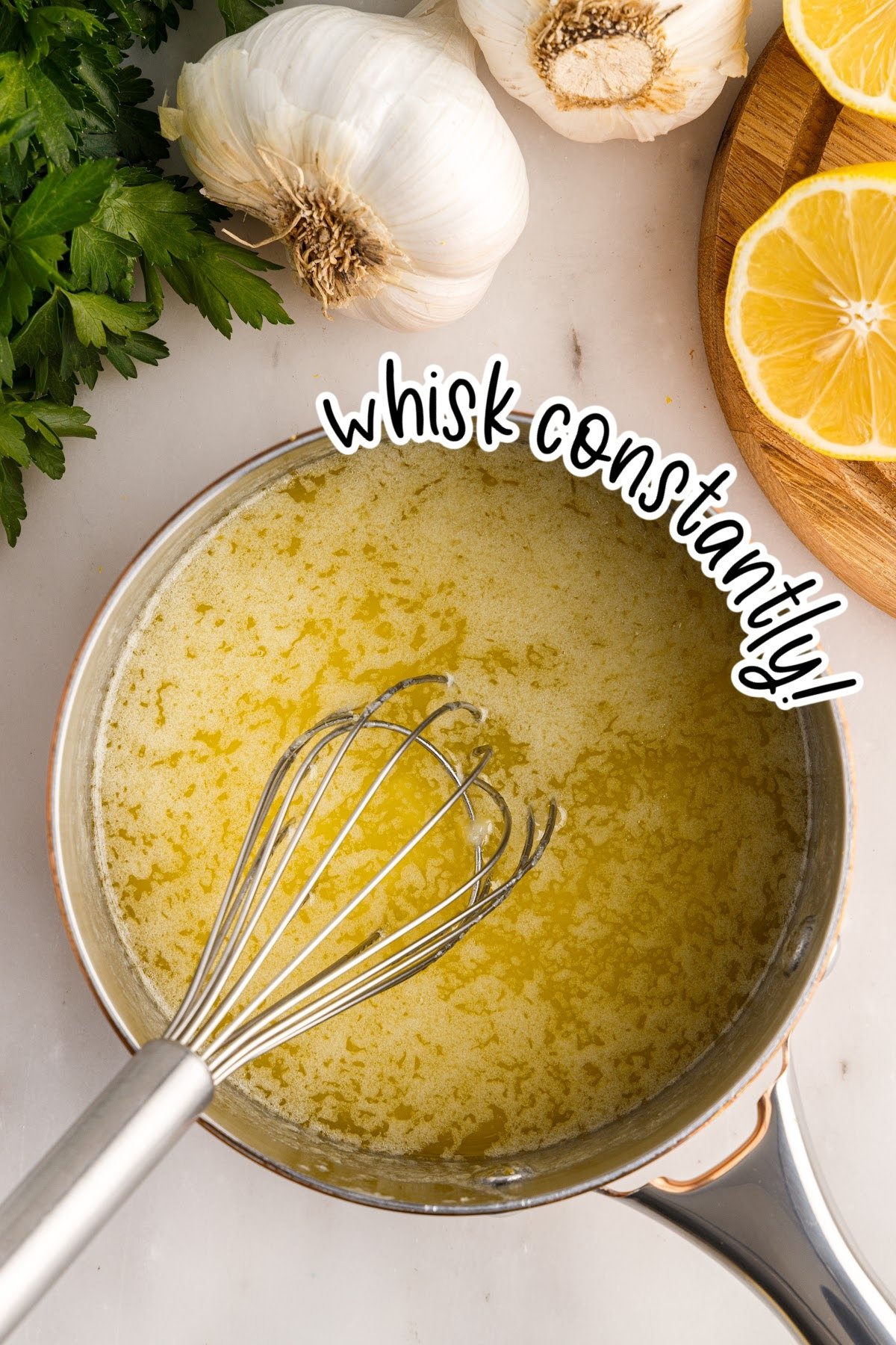 Garlic Butter Sauce whisked in a pan with text overlay.
