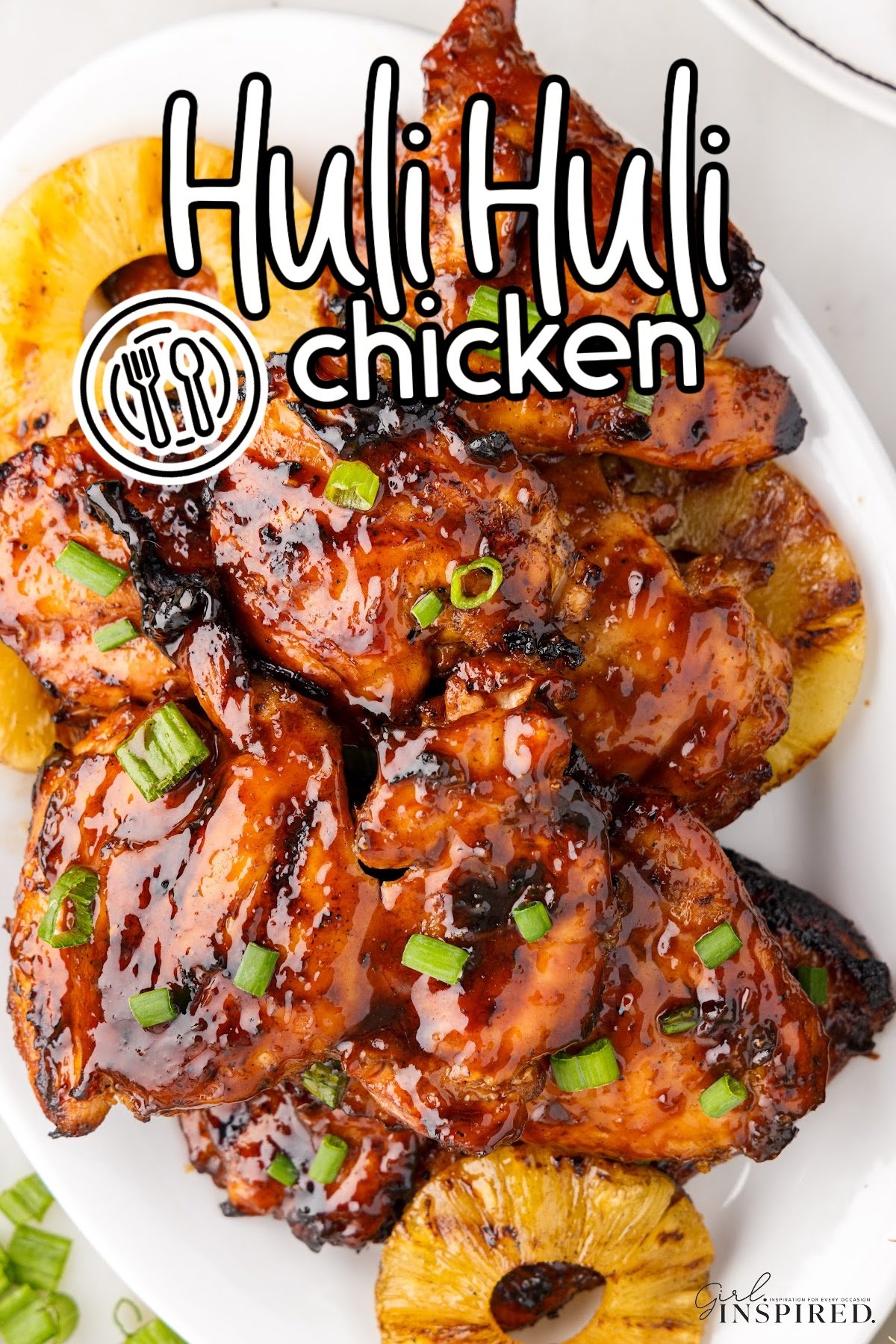 Huli Huli Chicken on an oval platter with pineapple slices with text overlay.