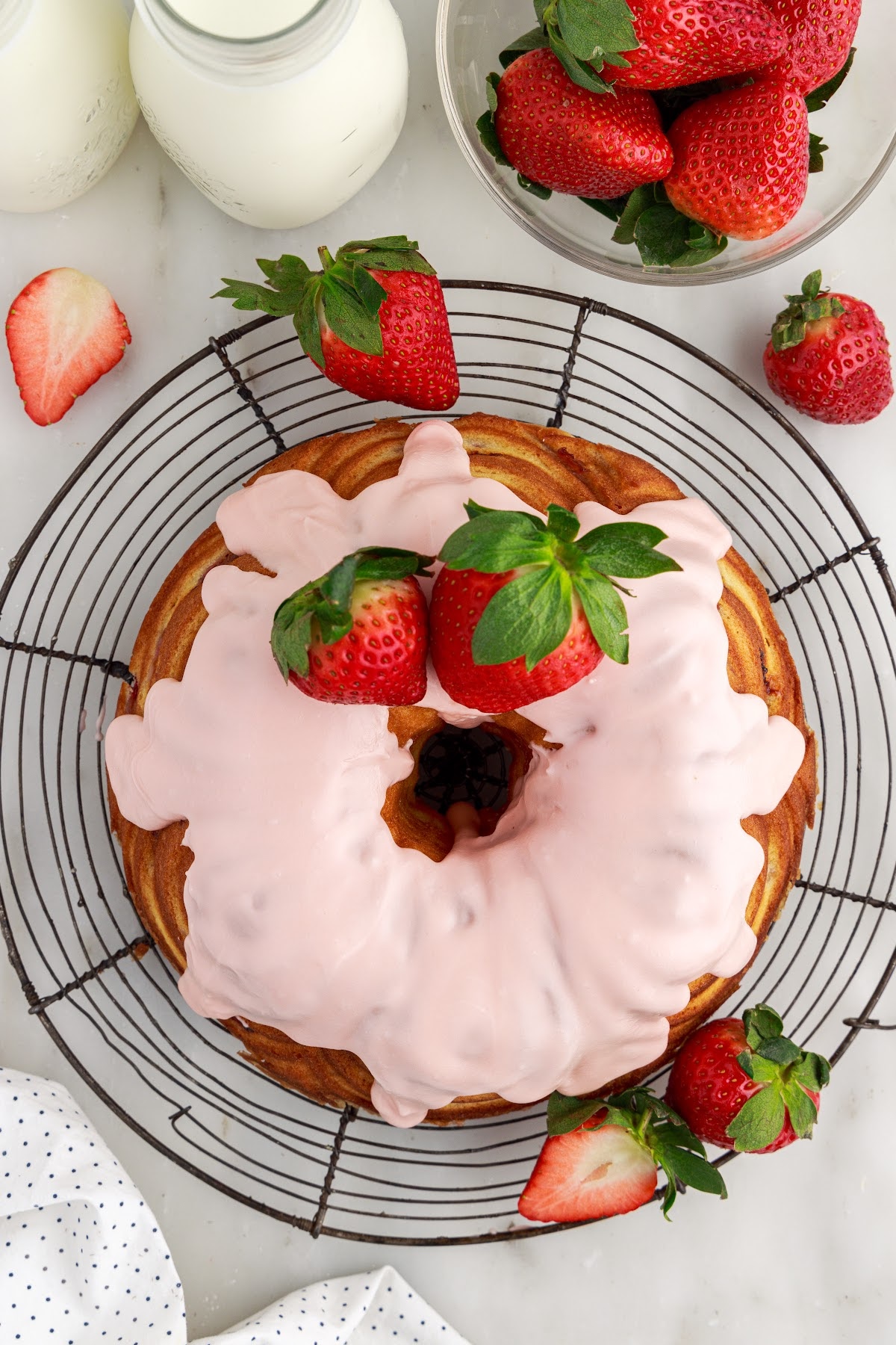 Overhead view of a Strawberry Bundt Cake with strawberries on top.