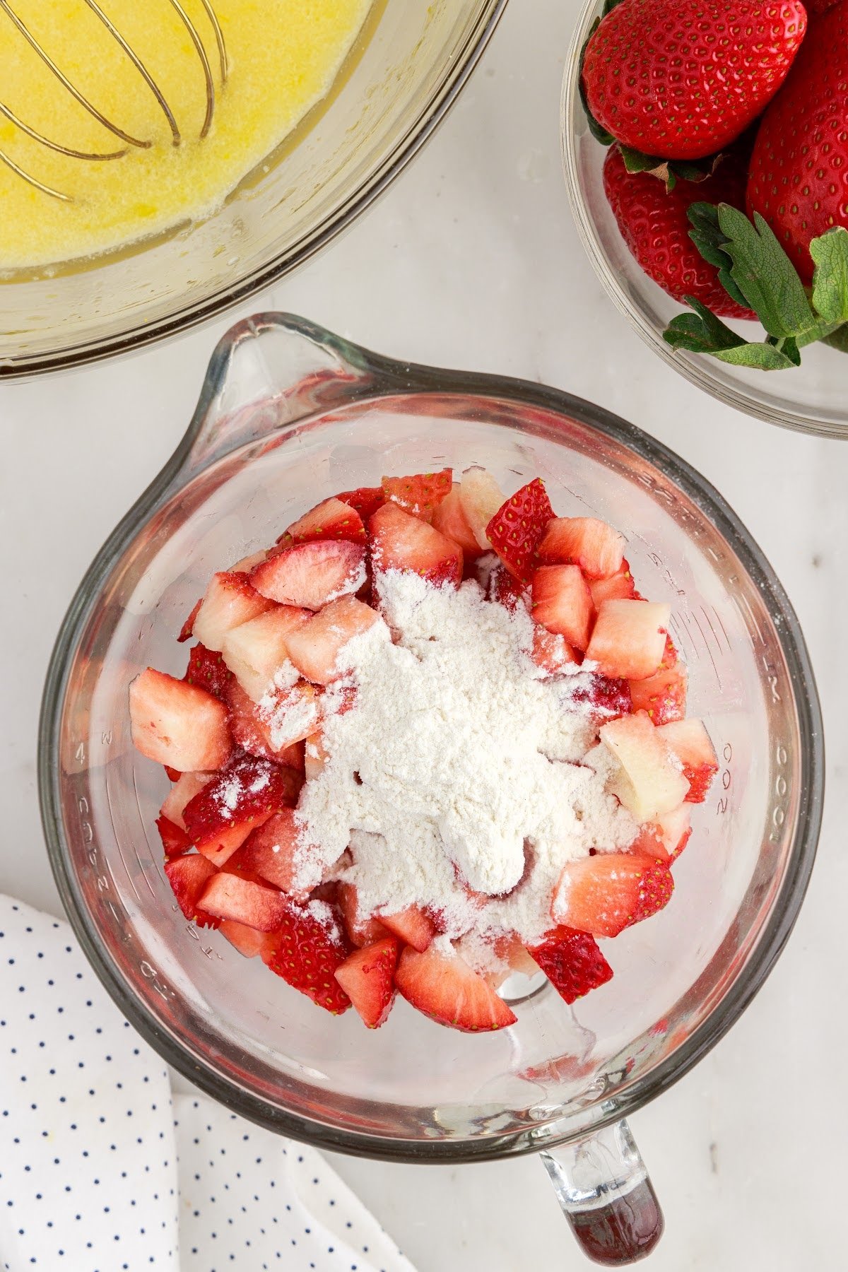 Flour added to strawberries.