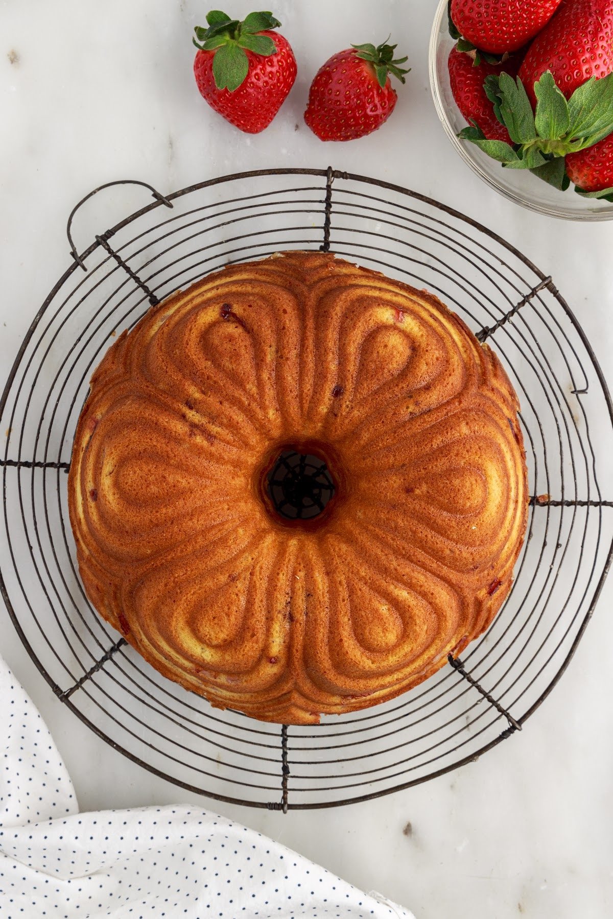 Strawberry Bundt Cake on a cooling rack.