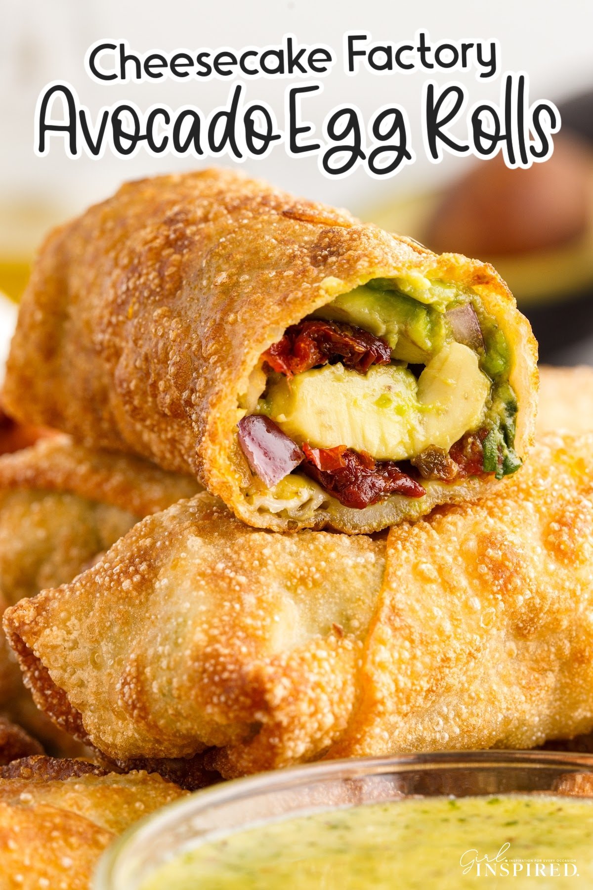 Cheesecake Factory Avocado Egg Rolls stacked on each other with text overlay.