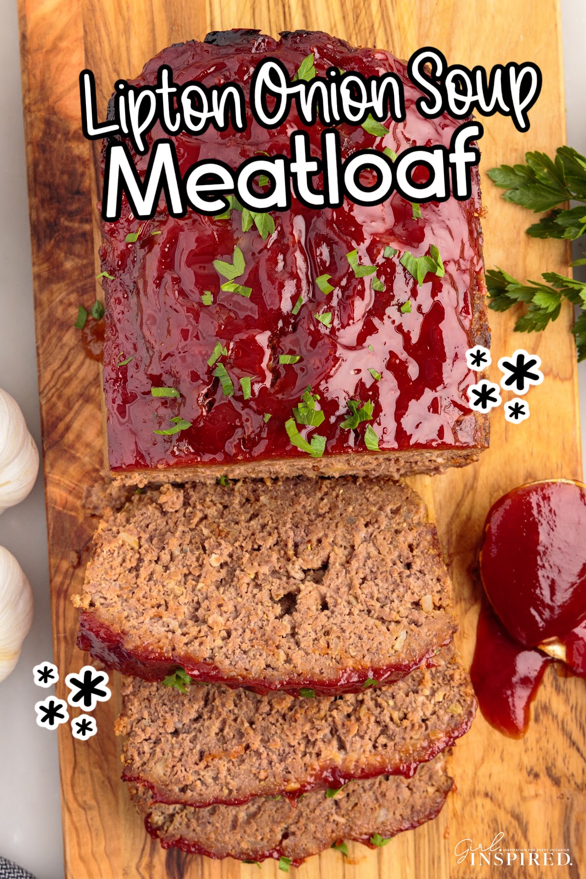 Overhead view of Lipton Onion Soup Meatloaf on a cutting board with three slices cut with text overlay.