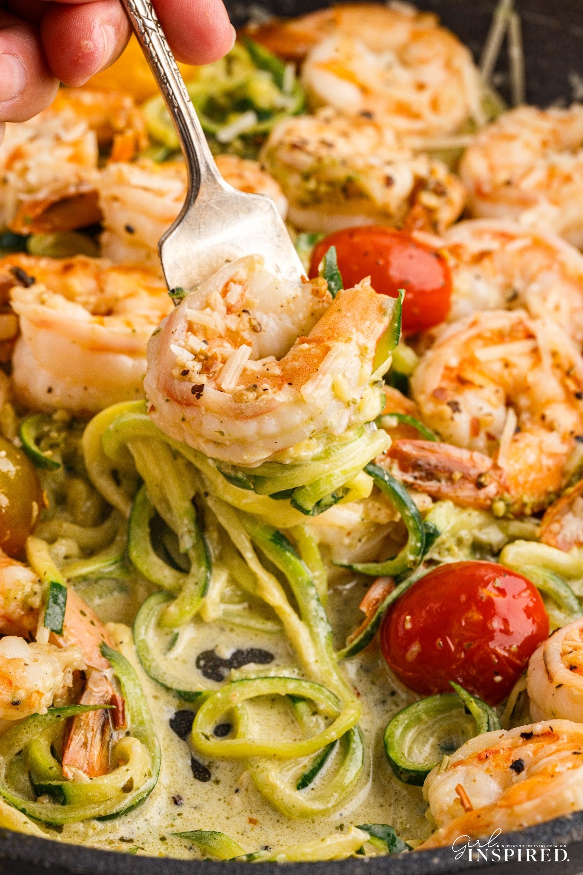 Close up of Pesto Zucchini Noodles with Shrimp with a fork in it.
